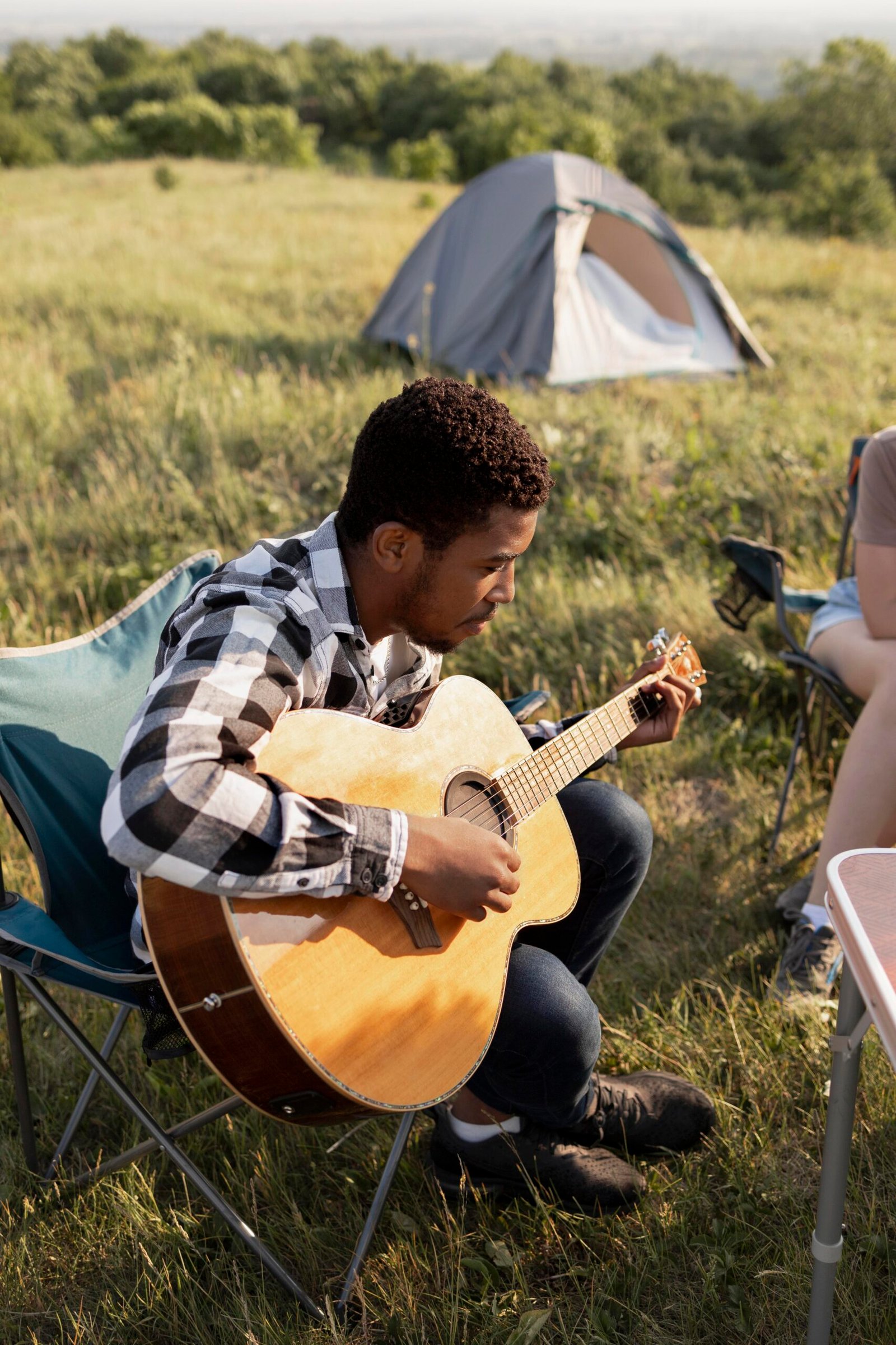 full shot man playing guitar